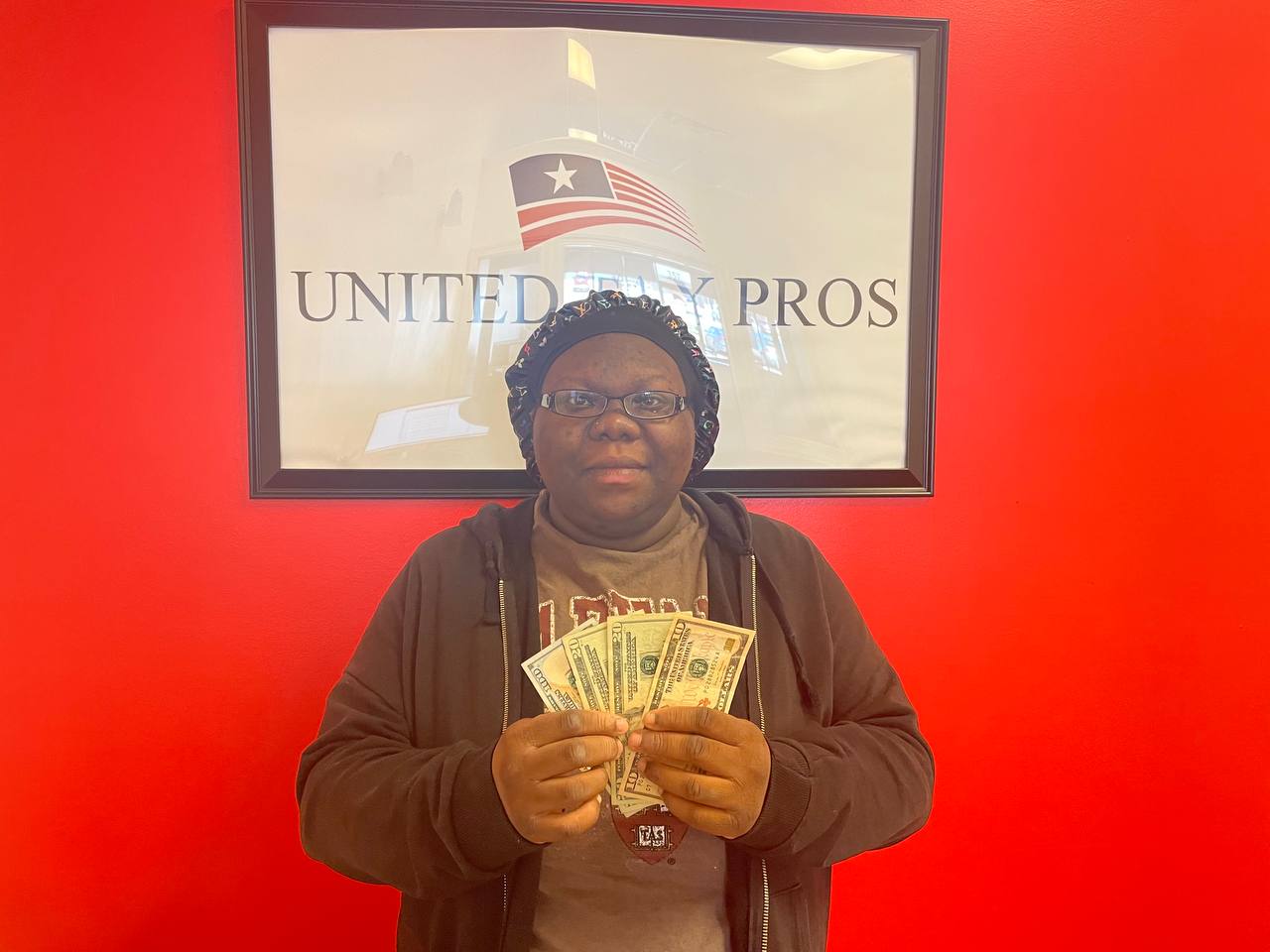 Real client receiving $150 referral reward cash